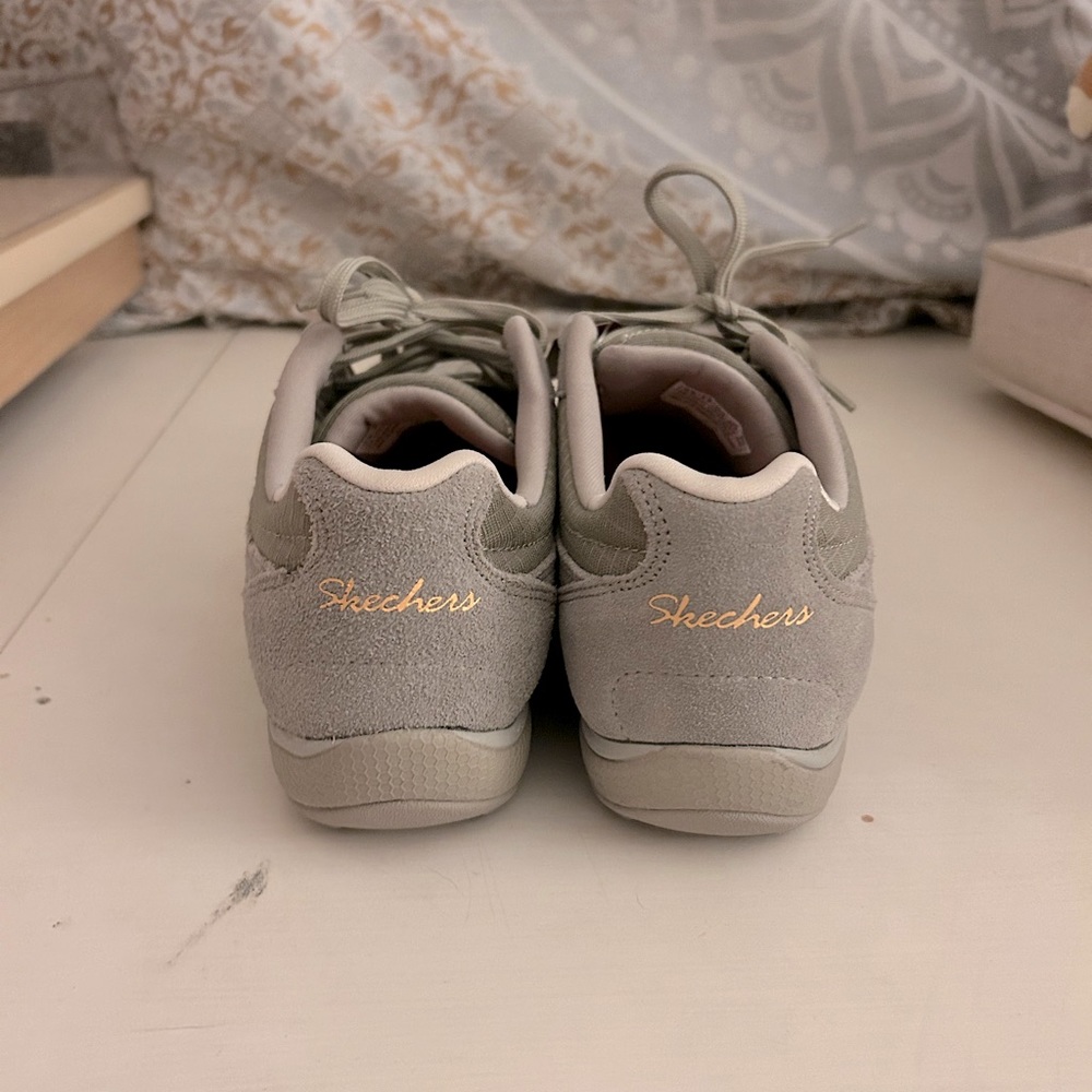 Skechers women’s grey and gold sneakers
